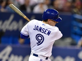 Blue Jays' Danny Jansen swings and misses during Tuesday night's game against Baltimore. (BRYAN PASSIFUME/Toronto Sun)