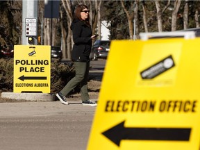 A woman leaves an advance polling location at the former Royal Alberta Museum in Edmonton, on Tuesday, April 9, 2019.
