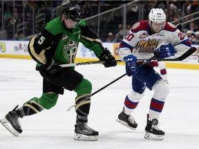 The Edmonton Oil Kings' David Kope (20) battles the Prince Albert Raiders' Zack Hayes (5) during Game 3 WHL Eastern Conference Championship first period action at Rogers Place, in Edmonton Tuesday April 23, 2019.