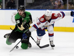 The Edmonton Oil Kings' Matthew Robertson (22) battles the Prince Albert Raiders' Brett Leason (20) during Game 3 WHL Eastern Conference Championship second period action at Rogers Place, in Edmonton Tuesday April 23, 2019.