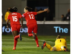 Christine Sinclair of Canada (12) celebrates as she  scores her team's first goal during the International Friendly against England at The Academy Stadium on April 05, 2019 in Manchester, England.