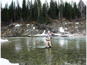 Neil casts a line on the Clearwater River. Neil Waugh/Edmonton Sun