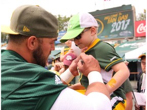 Eskimos long snapper Ryan King signs autographs during Eskimos Fan Day at Commonwealth Stadium in Edmonton on Tuesday, July 4, 2017.