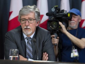 Canada's Privacy Commissioner Daniel Therrien responds to questions during a news conference on Thursday in Ottawa.