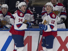 Edmonton Oil Kings Josh Williams (34) and Liam Keeler (12) watch the replay of a goal on the Oil Kings that Williams lost the puck in front of the net against the Prince Albert Raiders during WHL playoff action on Sunday, April 28, 2019, in Edmonton.