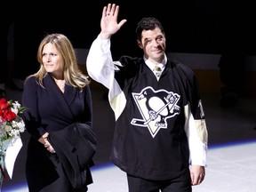 Bill Guerin waves to the crowd during his retirement ceremony before a game between the Pittsburgh Penguins and the New Jersey Devils at Consol Energy Center on December 6, 2010 in Pittsburgh, Pennsylvania.