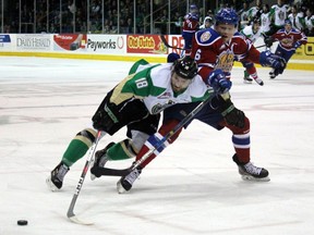 Edmonton Oil Kings defenceman Wyatt McLeod battles Prince Albert Raiders forward Noah Gregor for the puck during first-period action of Game 2 of the WHL Eastern Conference final Saturday, April 20, 2019, at Art Hauser Centre in Prince Albert, Sask.
