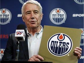 Oilers Entertainment Group CEO Bob Nicholson holds up a NHL draft card as he speaks about the Edmonton Oilers winning the draft lottery and potentially selecting top prospect Connor McDavid during a press conference held at Rexall Place in Edmonton on Monday April 20, 2015.