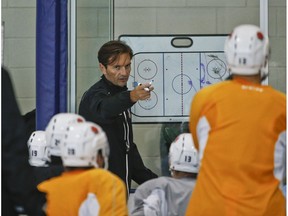 American Hockey League's (AHL) San Diego Gulls coach Dallas Eakins diagrams plays during hockey practice, Thursday, Oct. 8, 2015, in San Diego. Less than a year removed from being fired in mid-season by the Edmonton Oilers, Eakins professes not to be in a rush to get back to the NHL as he begins to develop the top farm team for the Anaheim Ducks, who play just 90 minutes up the freeway.