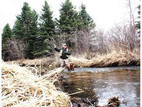 Neil and Penny on Alberta's famous spring creek, the North Raven River. Neil Waugh/Edmonton Sun