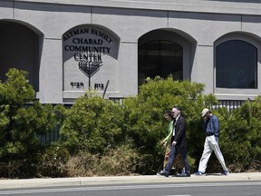 Synagogue members walk outside of the Chabad of Poway Synagogue Saturday, April 27, 2019, in Poway, Calif. Several people were injured in a shooting at the synagogue.