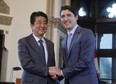 Japanese Prime Minister Shinzo Abe and Canadian Prime Minister Justin Trudeau take part in a welcoming ceremony on Parliament Hill in Ottawa on Sunday, April 28, 2019. (THE CANADIAN PRESS/ Patrick Doyle)