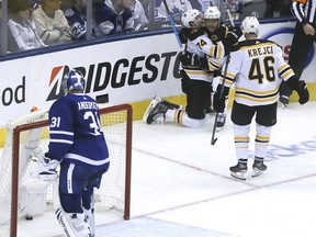 Boston Bruins' Jake DeBrusk (74) celebrates his team's third goal on Frederik Andersen on Sunday at Scotiabank Arena. The goal stood up as the game-winner. Veronica Henri/Toronto Sun/Postmedia Network