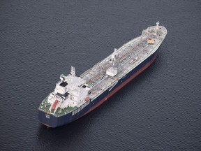 A tanker is anchored in Burrard Inlet just outside of Burnaby, B.C., on Friday, Nov. 25, 2016. The president of the company proposing the $16-billion Eagle Spirit Pipeline says his project could win regulatory endorsement if the federal government backs down on its plan to ban oil tanker traffic on the north coast of B.C.