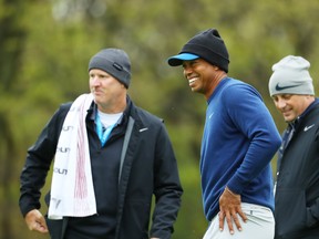 Tiger Woods and caddie Joe LaCava look on during a practice round prior to the PGA Championship at Bethpage Black on Monday in Bethpage, New York. (Photo by Warren Little/Getty Images)