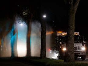 A street cleaner works along 112 Avenue in the Highlands neighbourhood in Edmonton, on Monday, May 13, 2019. Photo by Ian Kucerak/Postmedia