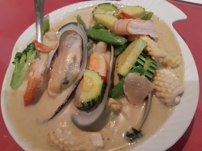 While the broth colour was not appealing, the seafood and green curry tang worked well.