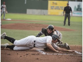 Michael Gahan of the Edmonton Prospects is tagged out at home plate by catcher Reed Odland of the Medicine Hat Mavericks at Re/Max field in Edmonton on August 7, 2018.  Game 3 of WMBL playoff series best of five.  Shaughn Butts / Postmedia Photos for copy in Thursday, Aug. 9 edition