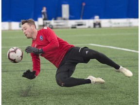 FC Edmonton goalkeeper Dylon Powley makes a save in practice at the Edmonton Soccer Dome on April 22, 2019.