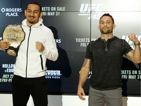 UFC featherweight champion Max Holloway (left) and contender Frankie Edgar pose for a photo during a press conference at Rogers Place in Edmonton, on Wednesday, May 29, 2019. UFC 240: Holloway Vs. Edgar takes place Saturday, July 27 at Rogers Place.