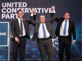 Jason Kenney (centre) celebrates with Brian Jean (left) and Doug Schweitzer (right) after Kenney was elected leader of the United Conservative Party. The leadership race winner was announced at the BMO Centre in Calgary on Saturday October 28, 2017.