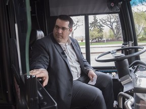 Eddie Robar, the Branch Manager of Edmonton Transit Service (ETS), demonstrated the first operator retractable shields for ETS buses on  May 15 2019. Photo by Shaughn Butts / Postmedia