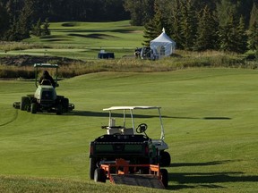 Groundkeepers on the fairways at Edmonton Petroleum Golf and Country Club in Spruce Grove, Alta.