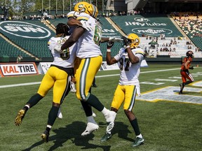 The Edmonton Eskimos celebrate a pre-season touchdown against the B.C. Lions in Edmonton on Sunday, May 26, 2019.