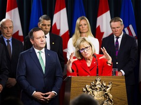 Premier Jason Kenney listens to Janice MacKinnon, a former Saskatchewan finance minister, and chair of a blue-ribbon panel announced to examine the Alberta government's financial situation. Taken on Tuesday, May 7, 2019, in Edmonton . (Greg Southam-Postmedia)