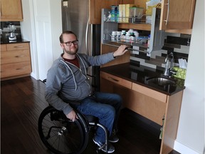 Joel Kleine is seen in his barrier-free home that's sparsely furnished so that the husband can negotiate his wheelchair.