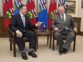 Ontario Premier Doug Ford, right, poses with Alberta Premier Jason Kenney at the Ontario Legislature in Toronto on Friday, May 3, 2019.