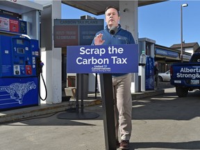 United Conservative Leader Jason Kenney responds to the federal carbon tax, which took effect Monday, during a news conference at the Lymburn Esso in west Edmonton, April 1, 2019.