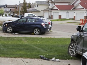 Damaged vehicles are seen near 7516 168 Ave. on Thursday, May 23, 2019. Edmonton homicide detectives are investigating the suspicious death of a 36-year-old man found nearby on Wednesday.