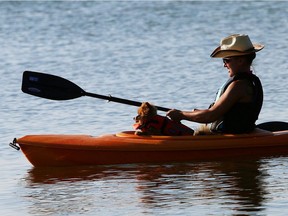 A woman take her dog for a kayak ride on Ma-Me-O Beach in this file photo.
