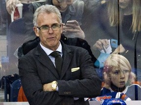 Edmonton Oilers head coach Todd Nelson, left, and general manager Craig MacTavish, right, run the bench during a game against the Dallas Stars at Rexall Place in this file photo from Dec. 21, 2014.