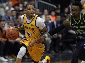 Niagara River Lions guard Alex Johnson (right) defends against Edmonton Stingers guard Xavier Moon (left) during Canadian Elite Basketball League action at the Edmonton Expo Centre on Friday, May 10, 2019.