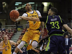Niagara River Lions Guillaume Boucard (right) defends against Edmonton Stingers Xavier Moon (left) during Canadian Elite Basketball League (CEBL) game action at the Edmonton Expo Centre on Friday May 10, 2019.