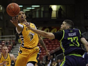 Niagara River Lions Guillaume Boucard (right) defends against Edmonton Stingers Xavier Moon (left) during Canadian Elite Basketball League (CEBL) game action at the Edmonton Expo Centre on Friday May 10, 2019.