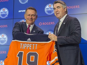 Edmonton Oilers general manager Ken Holland, left, welcomes Dave Tippett as the team's new head coach on Tuesday, May 28, 2019, at Edmonton's Rogers Place.