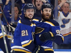 Blues centre Tyler Bozak (left) celebrates with Ryan O'Reilly (right) after Bozak scored a goal against the Sharks during the first period in Game 4 of the NHL's Western Conference final series in St. Louis, Friday, May 17, 2019.