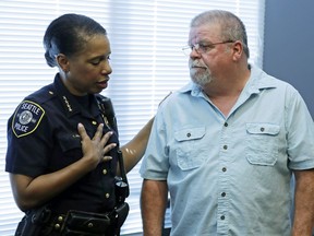 Seattle Police Chief Carmen Best, left, talks with Chris Galvin, Tuesday, May 7, 2019, in Seattle. Seattle police said Tuesday they have solved the 1967 cold case of the murder of Chris' sister, Susan Galvin, with the help of DNA and a family tree -- a method that has revolutionized cold-case investigations across the U.S.