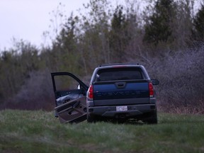 Edmonton police were called to investigate a body and smashed up pickup truck at the scene of a suspected homicide Wednesday, May 15, 2019, in west Edmonton at 184 Street near the Yellowhead Trail. Ian Kucerak/Postmedia