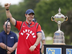 Rory McIlroy of Northern Ireland wears a Toronto Raptors jersey after he won the RBC Canadian Open at Hamilton Golf and Country Club on June 09, 2019 in Hamilton, Canada. (Photo by Michael Reaves/Getty Images)