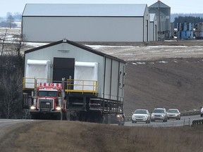 Crews moving large commercial building headed west on highway 19 near Devon in Edmonton, Wednesday, February 22, 2017. Ed Kaiser/Postmedia