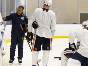 Edmonton Oilers assistant coach Manny Viveiros (left) runs a team practice at the Downtown Community Rink in Rogers Place in Edmonton, on Friday, April 5, 2019. The players played with their off hand during their last local practice of the season. Photo by Ian Kucerak/Postmedia