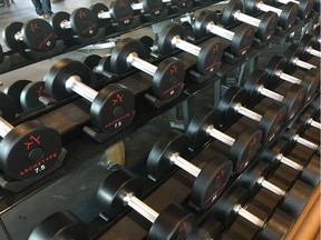 Dumbbells sit on a rack at Archetype fitness centre on the fifth floor of the J.W. Marriott Hotel in Ice District in Edmonton.