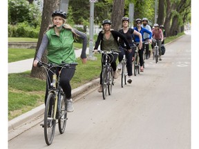 Krista Zerbin leads a group of cyclists down 83 Avenue near 106 Street on a bike ride hosted by the City of Edmonton's Bike Street Team on Wednesday, June 5, 2019, in Edmonton. Saturdays from June 1 - September 28, the City of Edmonton Bike Street Team will offer free guided bike ride alongs of Edmonton's southside and downtown protected bike routes. The ride alongs will depart the Old Strathcona Farmers' Market at 10 a.m. This is one of the city's Vision Zero initiatives to help people drive, bike and walk around Edmonton safely.