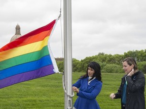 The pride flag was raised at the Alberta Legislature grounds on June 7, 2019, by Minister of Culture, Multiculturalism and Status of Women Leela Aheer and city Coun. Sarah Hamilton. Shaughn Butts/Postmedia