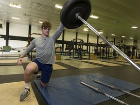 Sherwood Park hockey player Jake Lee works out at the Shamrock Curling Club .