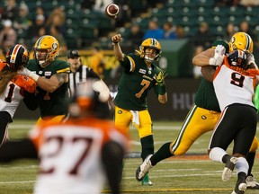 Edmonton Eskimos' quarterback Trevor Harris (7) throws as   BC Lions defensive linesmen are blocked during a CFL football game at Commonwealth Stadium in Edmonton, on Friday, June 21, 2019. Photo by Ian Kucerak/Postmedia